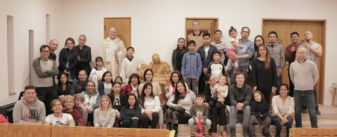The grateful parishioners, along with the Pietà. Photo: Irwin Dupitas